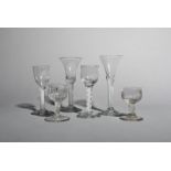 Four wine glasses, c.1760-70, two with rounded funnel bowls raised on multi series opaque twist