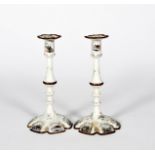 A small pair of Staffordshire enamel candlesticks, c.1770, the hexagonal feet printed and coloured