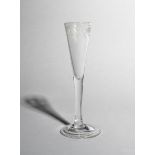 A ratafia glass, c.1750-60, with a slender drawn trumpet bowl engraved with a continuous band of