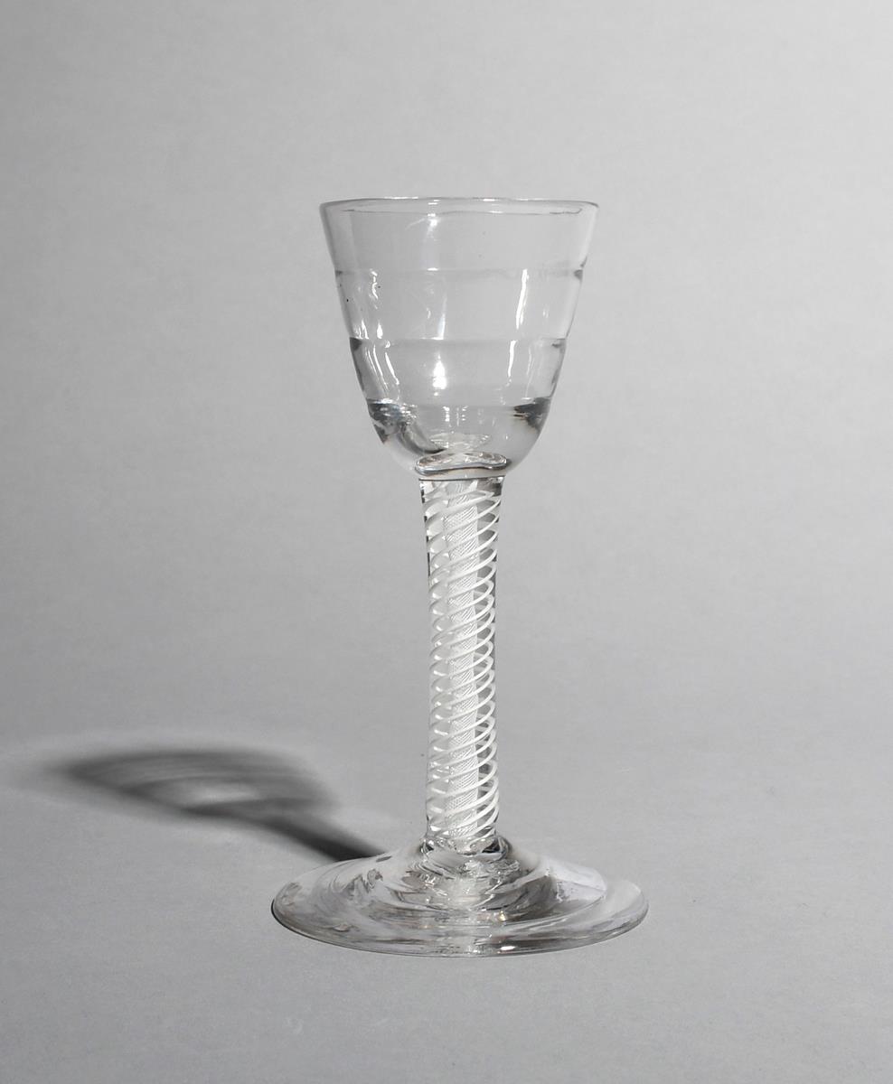 A small Lynn wine glass, c.1760, the rounded funnel bowl moulded with horizontal ribs and raised