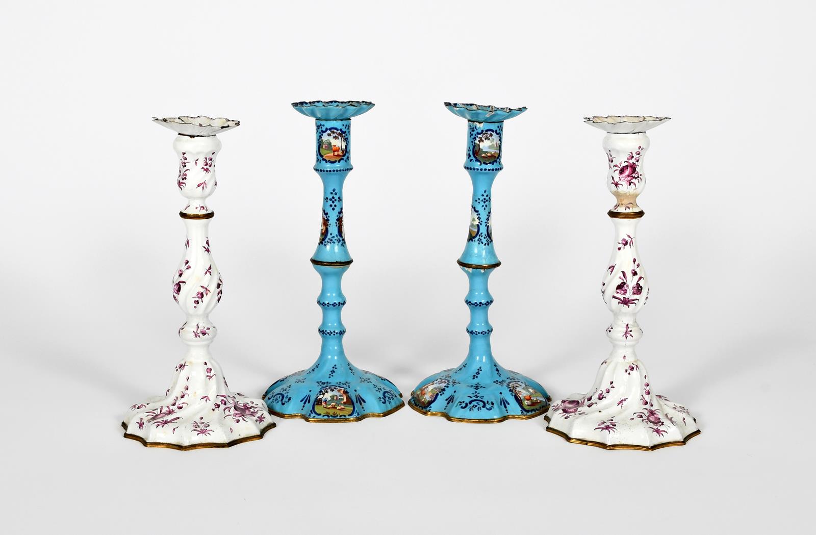 A pair of Staffordshire enamel candlesticks, c.1770, of spiral moulded form, painted in puce camaieu