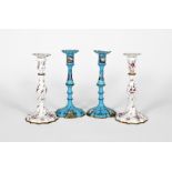 A pair of Staffordshire enamel candlesticks, c.1770, of spiral moulded form, painted in puce camaieu