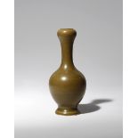 A SMALL CHINESE GARLIC-MOUTH VASE 18TH CENTURY The ovoid body raised on a short spread foot and