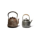 TWO JAPANESE KETTLES AND COVERS, TETSUBIN MEIJI PERIOD, 19TH CENTURY OR LATER One in iron, of