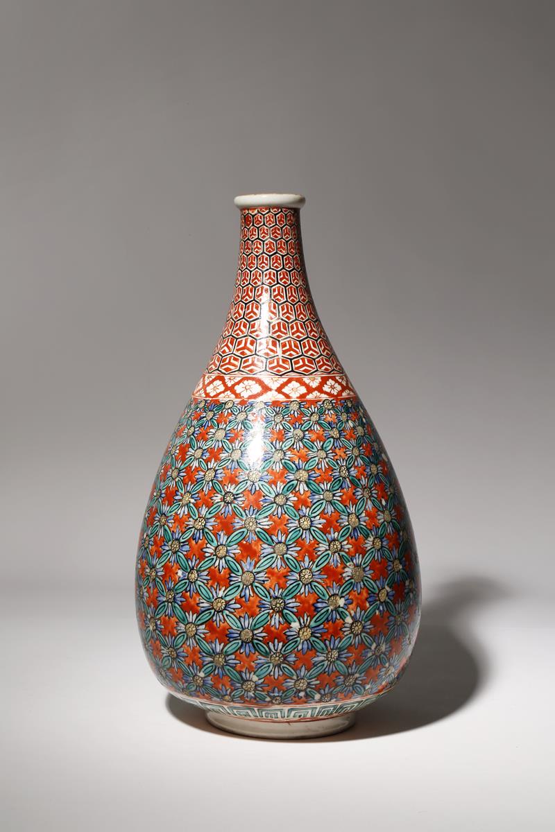 A JAPANESE KUTANI BOTTLE VASE MEIJI PERIOD, 19TH CENTURY The tall body richly decorated in gilt