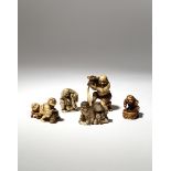 FIVE JAPANESE IVORY NETSUKE MEIJI PERIOD, 19TH CENTURY One large okimono­-style netsuke carved as