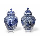 A PAIR OF LARGE JAPANESE ARITA BLUE AND WHITE BALUSTER VASES AND COVERS EDO PERIOD, CIRCA 1700 Of