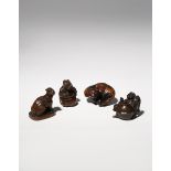 FOUR JAPANESE WOOD NETSUKE EDO PERIOD AND LATER, 18TH CENTURY AND LATER Two carved as tanuki