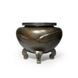 A MASSIVE JAPANESE BRONZE JARDINIERE MEIJI PERIOD, 19TH CENTURY Raised on four scrolling legs, the