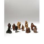 TEN JAPANESE WOOD NETSUKE OF FIGURES MEIJI PERIOD, 19TH CENTURY Variously depicting travellers,