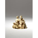 A JAPANESE IVORY CARVING, OKIMONO MEIJI PERIOD, 19TH CENTURY Depicting a group of four figures,