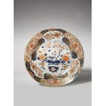 A JAPANESE IMARI DISH EDO PERIOD, 18TH CENTURY Typically decorated in underglaze blue, gilt and