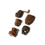 FOUR JAPANESE MASK NETSUKE MEIJI PERIOD, 19TH CENTURY Two in metal and two in wood, variously