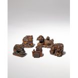 FIVE JAPANESE WOOD NETSUKE OF SHISHI MEIJI PERIOD, 19TH CENTURY The lion dogs depicted in a