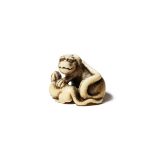 A JAPANESE IVORY NETSUKE OF A TIGER AND HER CUB EDO PERIOD, 18TH CENTURY The feline depicted with