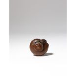 A JAPANESE WOOD NETSUKE OF A SNAIL MEIJI PERIOD, 19TH CENTURY Emerging from its shell and bending