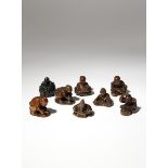 SEVEN JAPANESE WOOD NETSUKE OF FIGURES MEIJI PERIOD, 19TH CENTURY Depicting men engaged in various