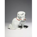 A JAPANESE KUTANI MODEL OF A DOG, OKIMONO MEIJI PERIOD OR LATER, 19TH OR 20TH CENTURY The small