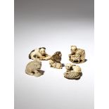 FIVE JAPANESE IVORY NETSUKE OF DOGS MEIJI PERIOD, 19TH CENTURY The first depicting Hanasaka Jiisan