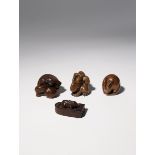 FOUR JAPANESE WOOD NETSUKE EDO PERIOD AND LATER, 18TH CENTURY AND LATER Three depicting rabbits: one