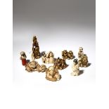 NINE JAPANESE IVORY NETSUKE MEIJI PERIOD, 19TH CENTURY Depicting figures engaged in various