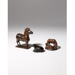 THREE JAPANESE WOOD NETSUKE OF HORSES MEIJI PERIOD, 19TH CENTURY The largest depicted standing on