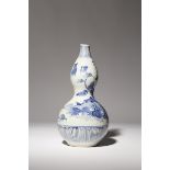 A JAPANESE ARITA BLUE AND WHITE SAKE BOTTLE, TOKKURI EDO PERIOD, 17TH CENTURY Shaped as a double