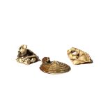 THREE JAPANESE NETSUKE OF RATS MEIJI PERIOD, 19TH CENTURY Two in ivory, the first depicted on a