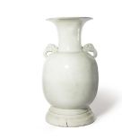 A MASSIVE JAPANESE ARITA WHITE GLAZED VASE EDO PERIOD, 18TH CENTURY The ovoid body raised on a