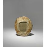 A CHINESE DUAN STONE INKSTONE QING DYNASTY Naturalistically carved as a boulder, with a pine tree at