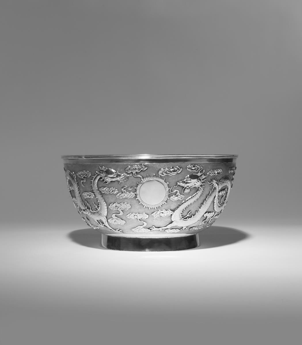 A CHINESE SILVER 'DRAGON' BOWL 2ND HALF 19TH CENTURY The deep body decorated in relief with four