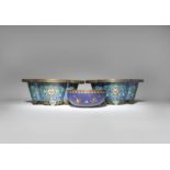 A CHINESE CLOISONNE 'BUTTERFLY' BOWL AND A PAIR OF CLOISONNE JARDINIERES 19TH CENTURY The bowl