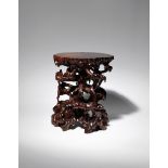 A CHINESE HARDWOOD STAND 20TH CENTURY Naturalistically formed as many twisting gnarled tree