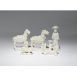 TWO CHINESE BLANC DE CHINE MODELS OF HORSES AND THREE WHISTLES KANGXI 1662-1722 The horses