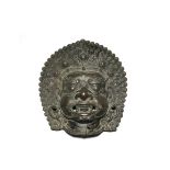 A LARGE INDIAN BRONZE MASK OF BHAIRAVA 18TH CENTURY The fierce manifestation of Shiva with his mouth