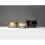 THREE CHINESE BRONZE INCENSE BURNERS QING DYNASTY One with a bombé-shaped body and two loop handles,