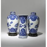 A PAIR OF CHINESE BLUE AND WHITE OVOID VASES AND A BEAKER VASE KANGXI 1662-1722 Decorated with