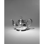 A CHINESE SILVER 'FIVE DRAGON' TEAPOT 2ND HALF 19TH CENTURY The ovoid body decorated in repoussι