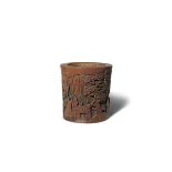 A CHINESE BAMBOO 'SCHOLARS' BRUSHPOT, BITONG 20TH CENTURY The cylindrical body carved in relief with