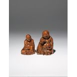 TWO CHINESE BAMBOO SEATED FIGURES QING DYNASTY One carved as one of the Hehe Erxian, he smiles