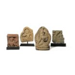 THREE CARVED STONE FRAGMENTARY RELIEFS AND A TERRACOTTA TSA-TSA C.2ND CENTURY AND LATER