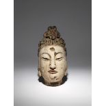 A CHINESE POLYCHROME CARVED WOOD HEAD OF GUANYIN PROBABLY MING DYNASTY The goddess casts her eyes