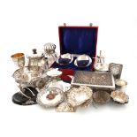 λA mixed lot of silver items, comprising: a Victorian silver-mounted glass inkwell, London 1884, a