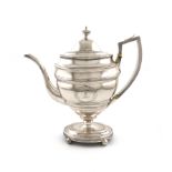 λA George III silver coffee pot, by Robert and David Hennell, London 1800, oval form, bright-cut