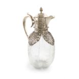 An Edwardian silver-mounted glass decanter, by William Comyns, London 1904, lobed ovoid form, etched