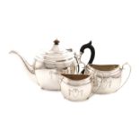 A three-piece silver tea set, by The Barnards, London 1905 and 1906, oval form, scroll handles,