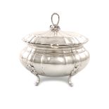 A German silver tea caddy / sugar box, circa 1920, lobed oval bellied form, the hinged cover with