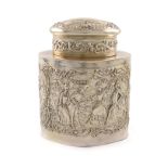 A German silver tea caddy, probably Hanau, circa 1900, shaped oval form, embossed with Rococo