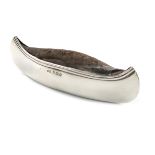 An Edwardian novelty silver canoe pin cushion, by H. Matthews, Birmingham 1904, length 13cm.