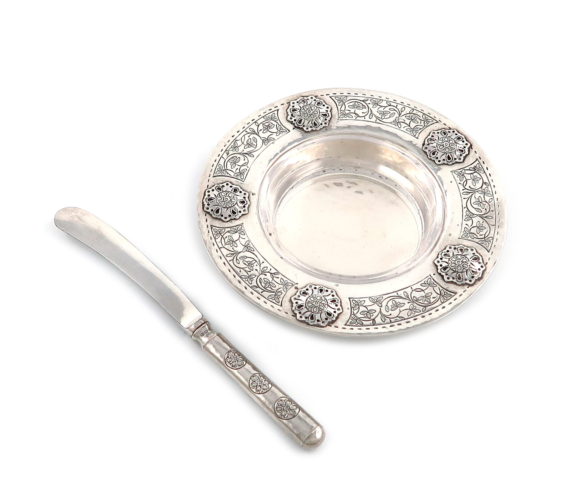 By Liberty and Co., an Arts and Crafts silver butter dish and butter knife, Birmingham 1927, the